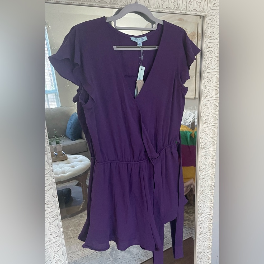 Purple Romper with ruffle detail